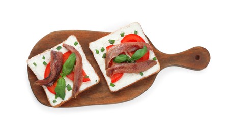 Photo of Delicious sandwiches with cream cheese, anchovies, tomatoes and basil on white background, top view