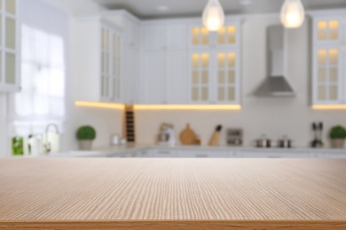 Image of Wooden table in light kitchen. Space for design