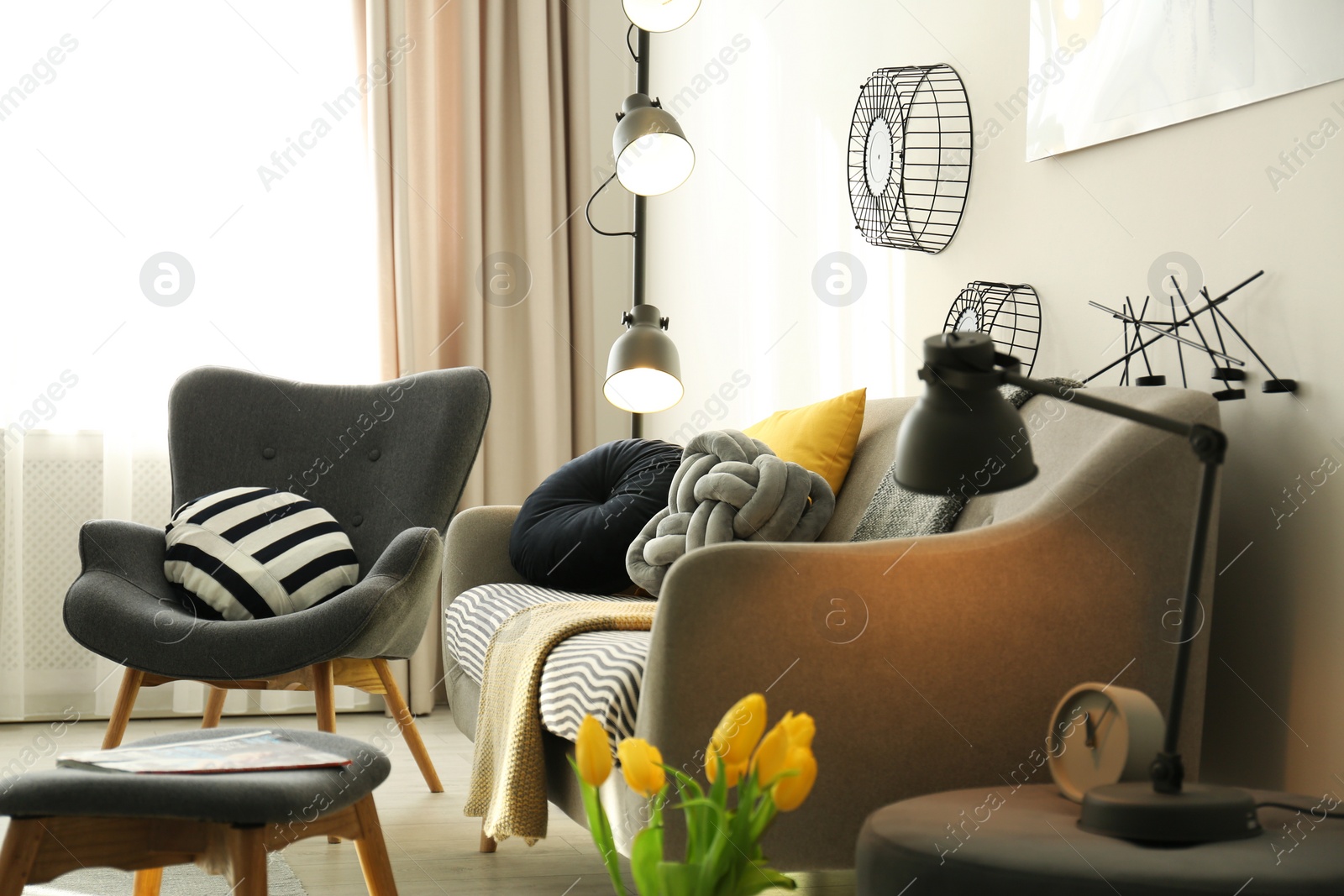 Photo of Stylish living room interior with comfortable sofa. Idea for home decor