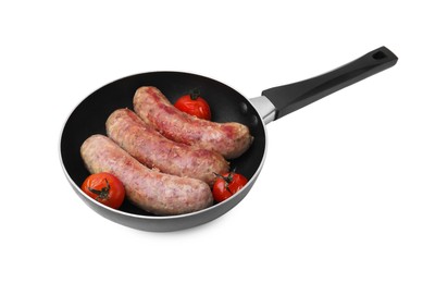 Frying pan with tasty homemade sausages and tomatoes isolated on white