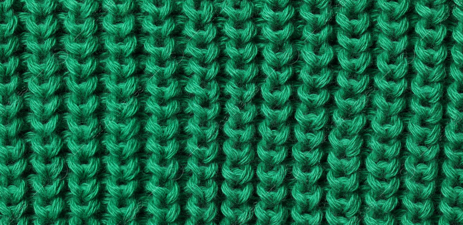 Photo of Texture of soft green fabric as background, top view