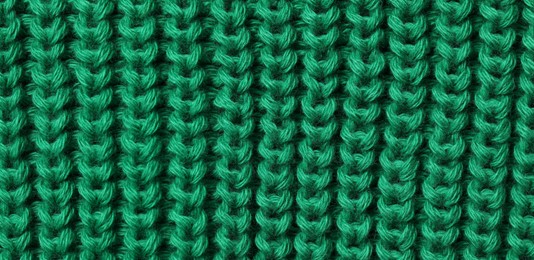 Photo of Texture of soft green fabric as background, top view