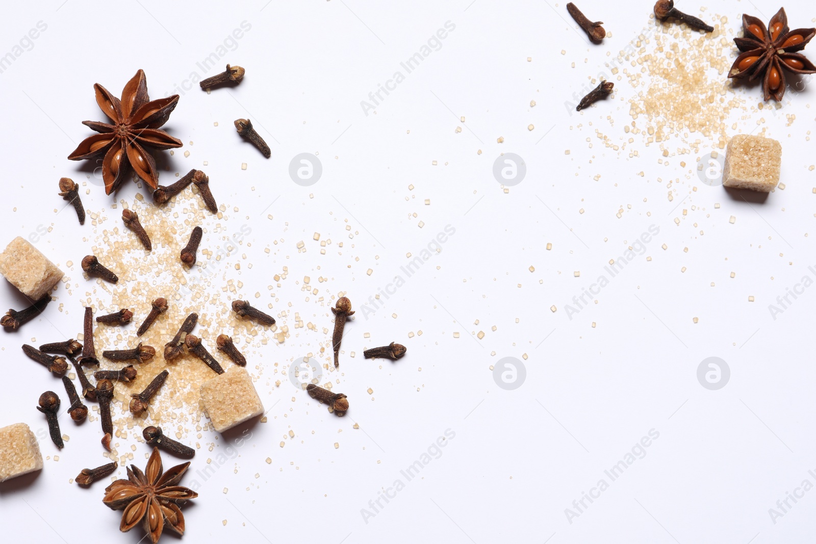 Photo of Different spices on white table, flat lay. Space for text