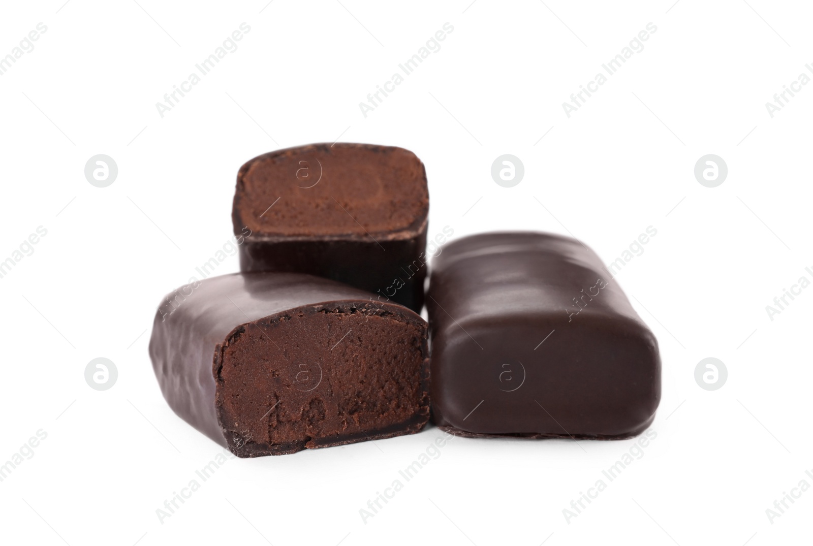 Photo of Delicious glazed cut and whole cheeses with cocoa on white background