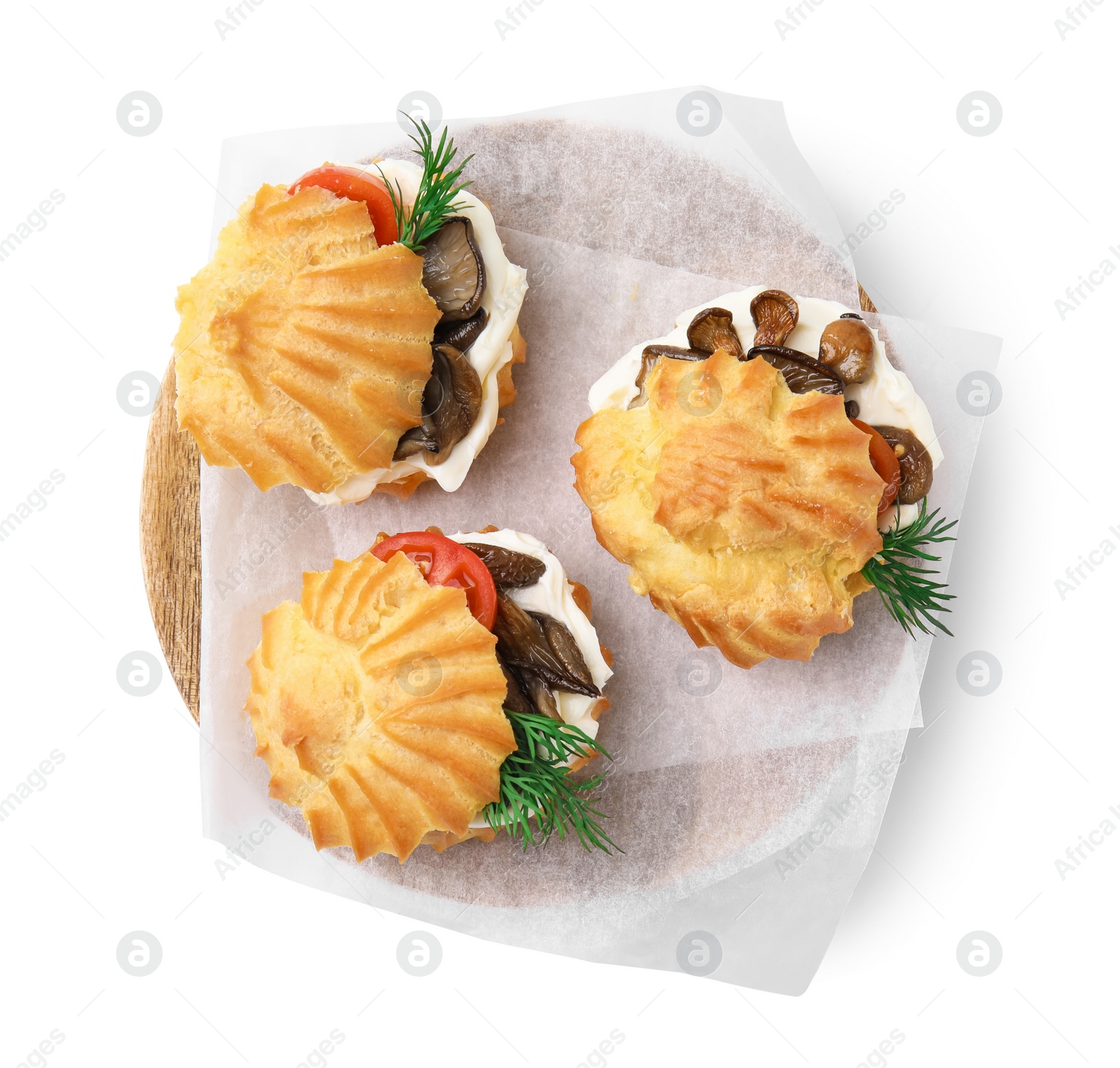 Photo of Delicious profiteroles with cream cheese, mushrooms, tomato and dill on white background, top view