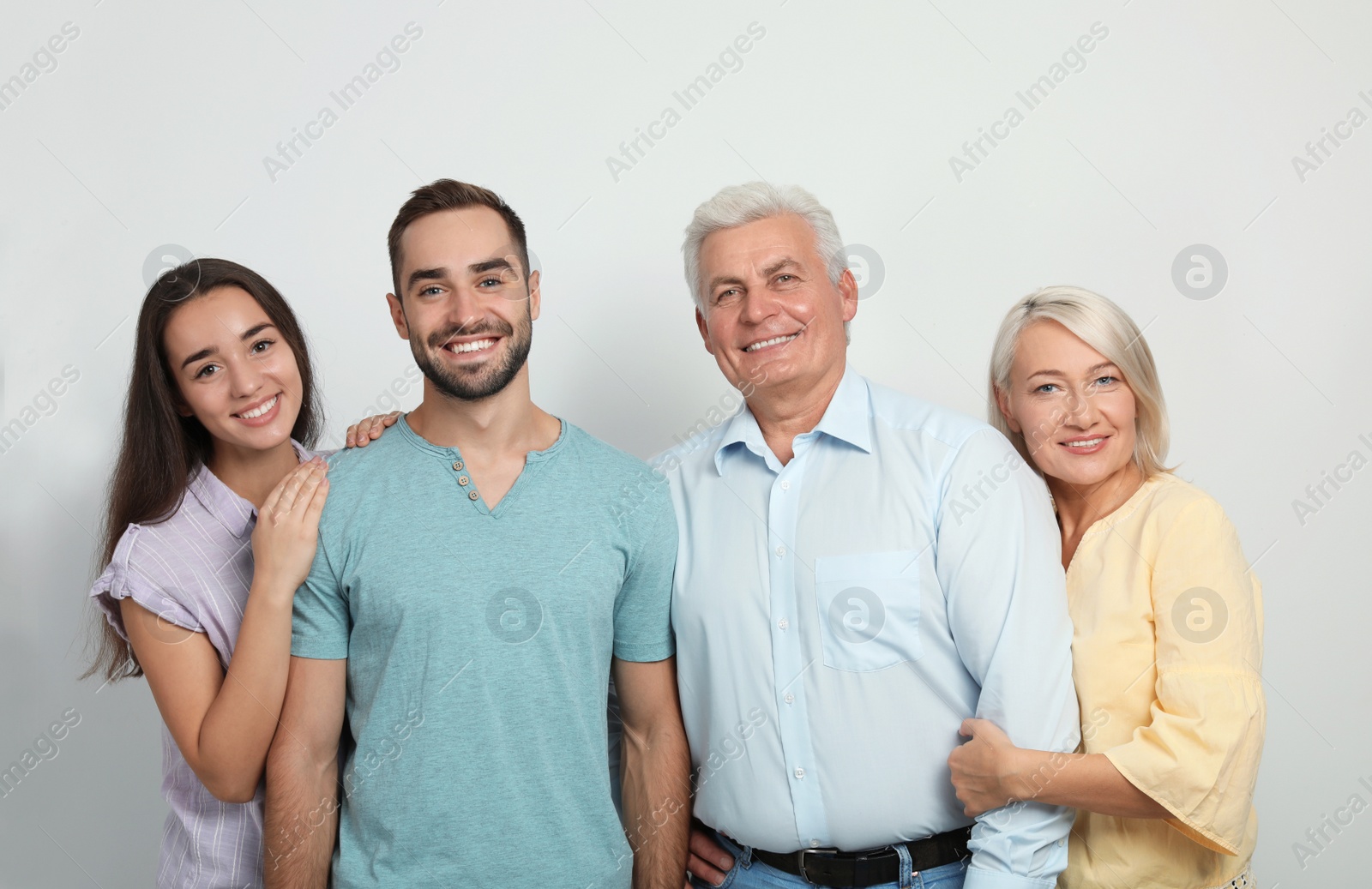 Photo of Portrait of happy family on white background