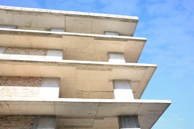 Exterior of reconstruction building against blue sky, low angle view