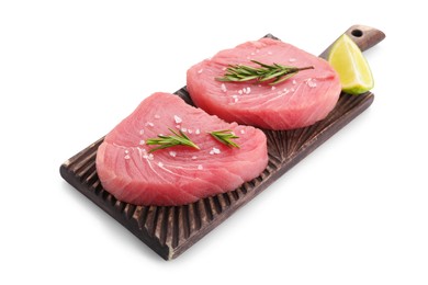Raw tuna fillets with salt, rosemary and lime wedge on white background