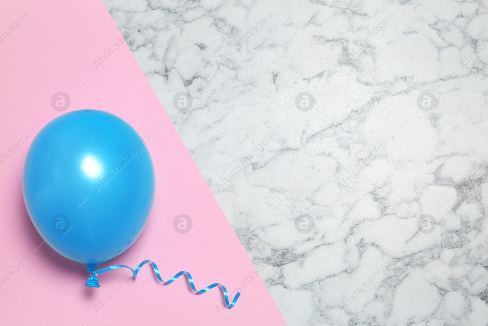 Photo of Bright balloon on colorful background, top view with space for text. Party time