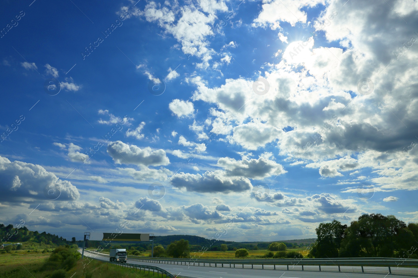 Photo of Picturesque view on beautiful cloudy sky and green field