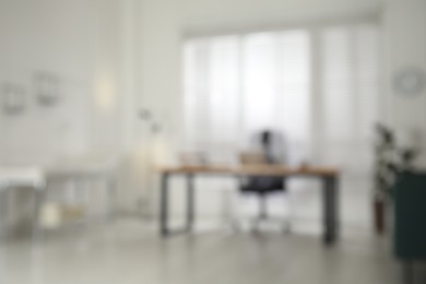 Blurred view of modern medical office with doctor's workplace. Interior design