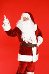 Photo of Happy authentic Santa Claus on red background