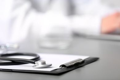 Photo of Medical students stuff on table against blurred background. Space for text