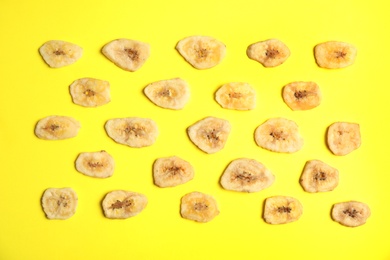 Flat lay composition with banana slices on color background. Dried fruit as healthy snack