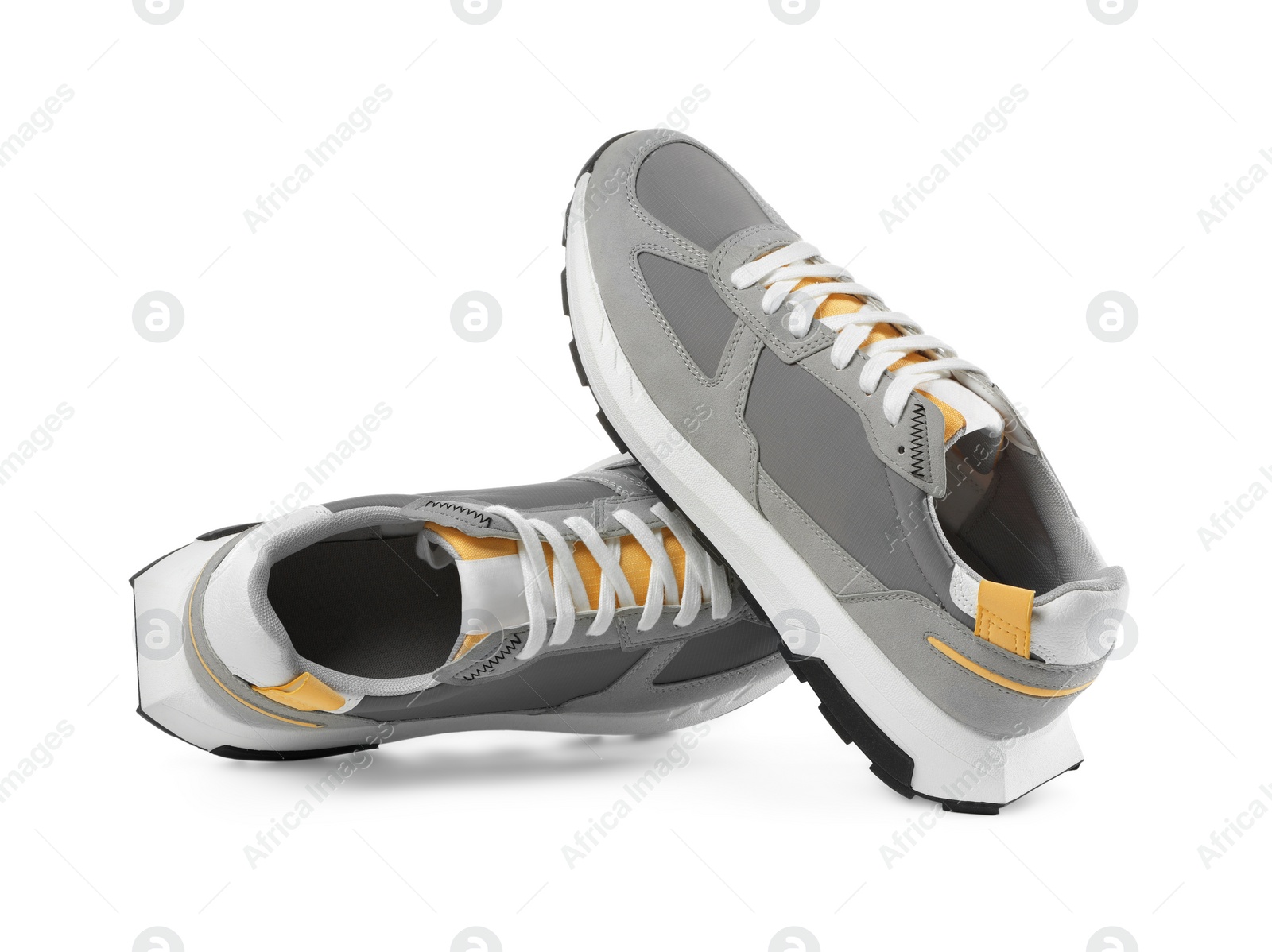 Photo of Pair of stylish grey sneakers isolated on white