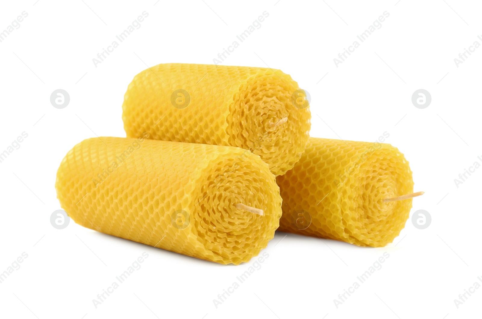 Photo of Stylish elegant beeswax candles isolated on white