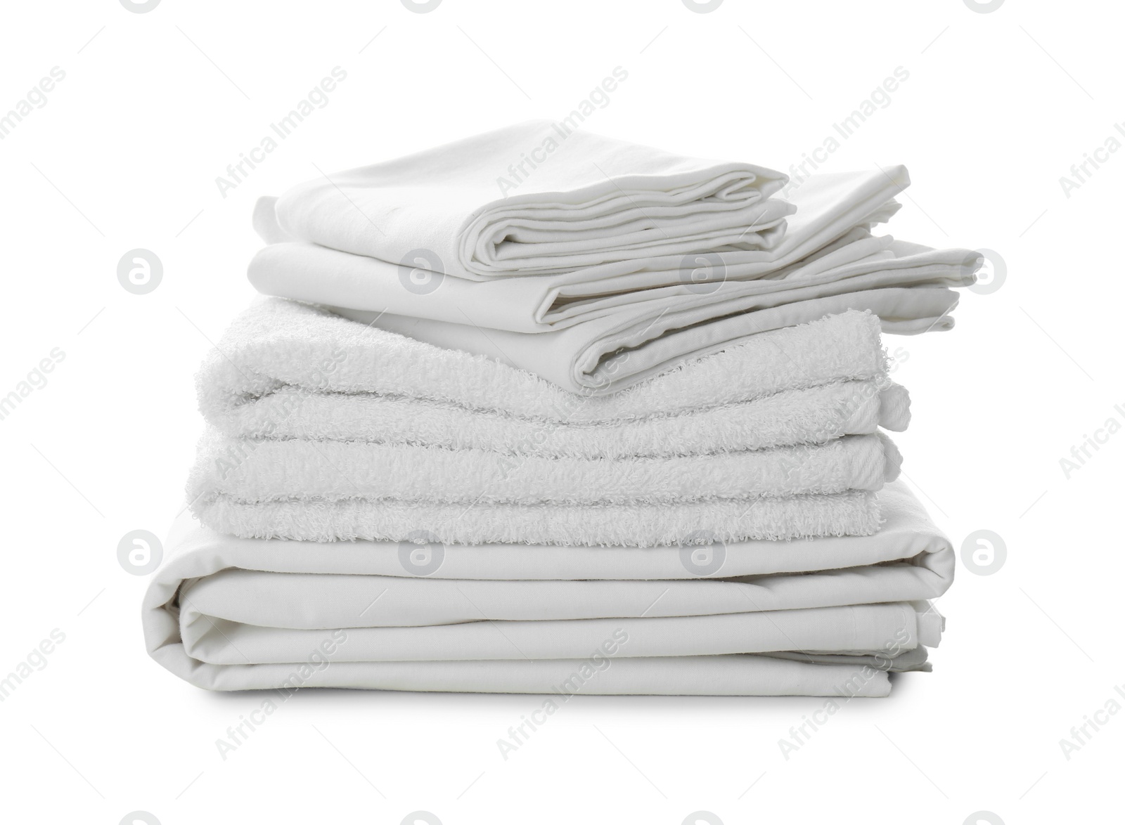 Photo of Stack of towels and bed sheets on white background