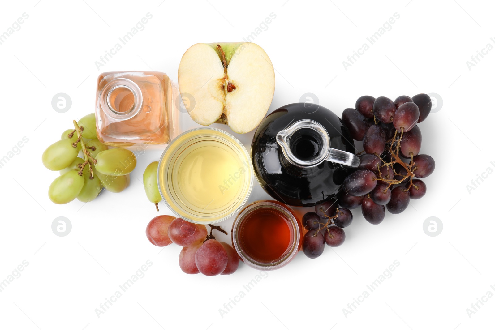 Photo of Different types of vinegar and ingredients isolated on white, top view