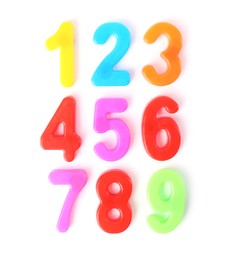 Colorful numbers on white background, top view