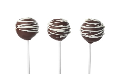 Photo of Tasty cake pops decorated with chocolate isolated on white