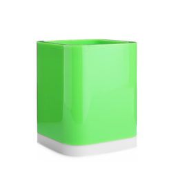 Photo of Green plastic holder isolated on white. Stationery for school