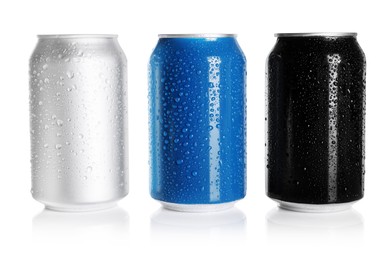 Photo of Aluminum cans with drinks on white background