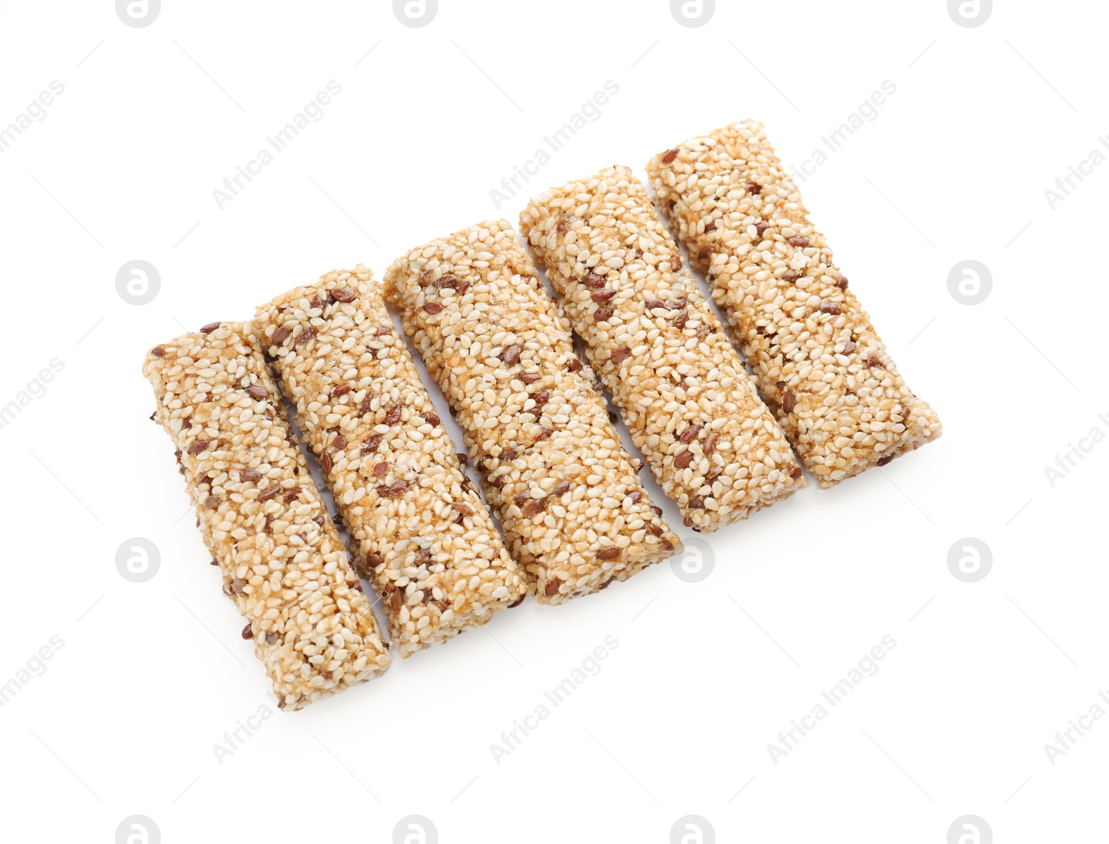 Photo of Tasty sesame seed bars isolated on white