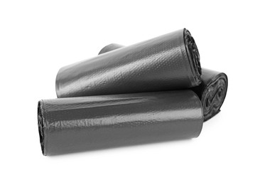 Photo of Rolls of black garbage bags isolated on white