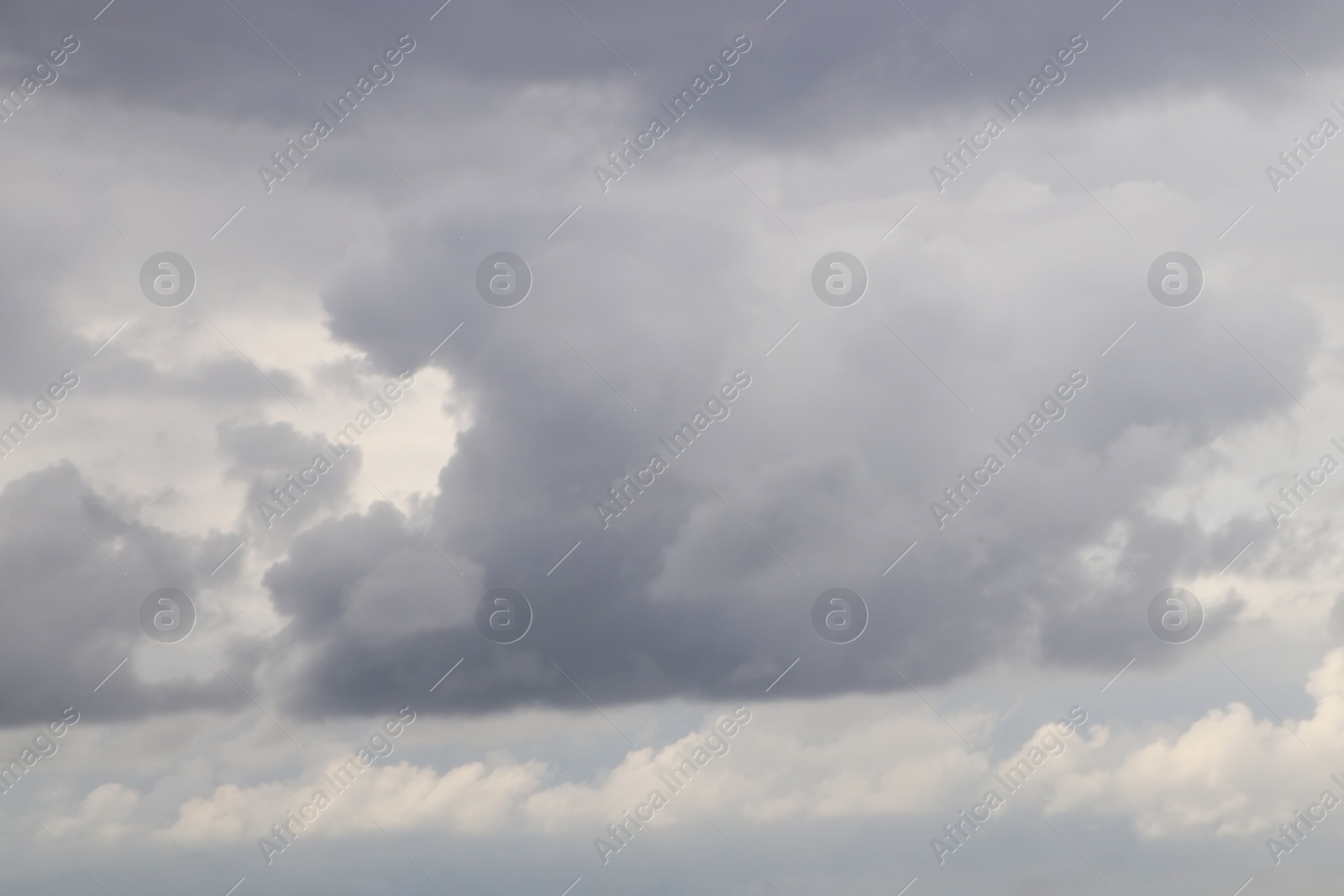 Photo of Sky with heavy rainy clouds on grey day