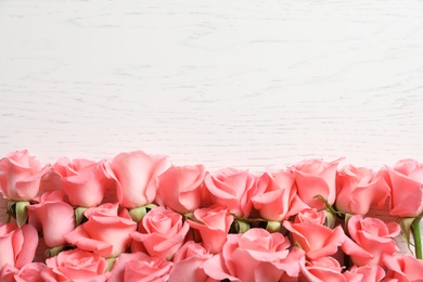 Beautiful roses on wooden table