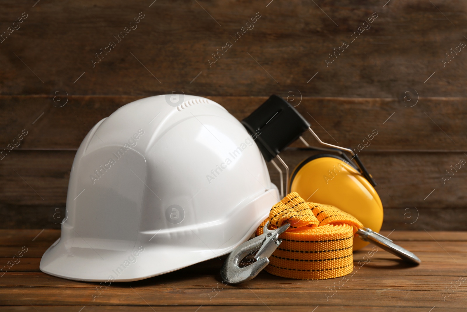 Photo of Composition with safety equipment on wooden table