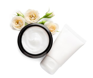 Different hand care cosmetic products and roses on white background, top view