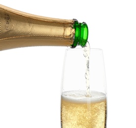 Pouring champagne from bottle into glass on white background. Festive drink