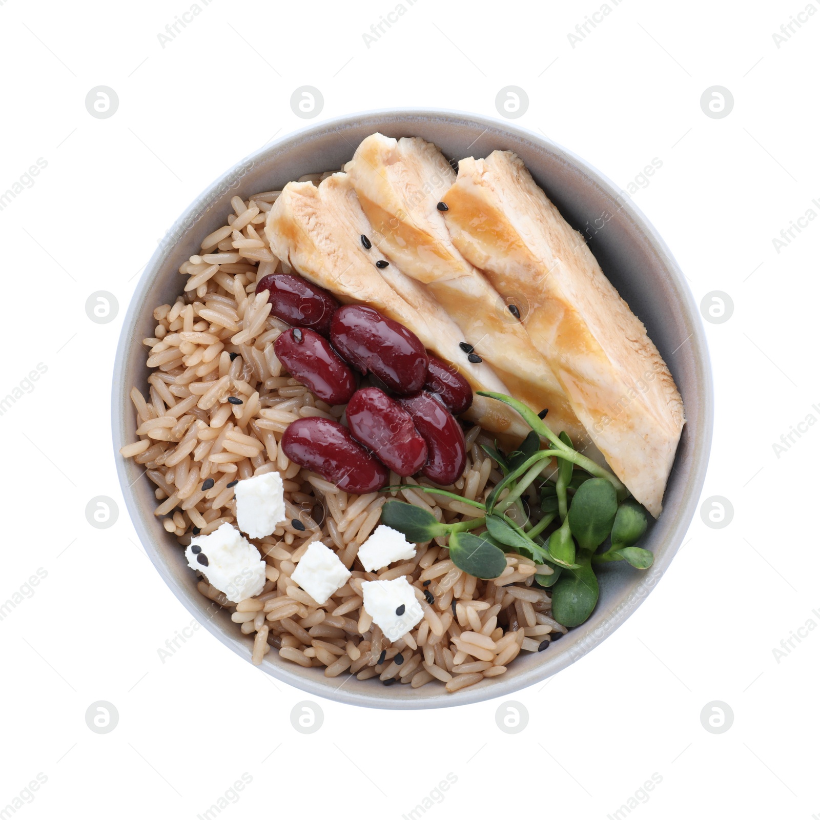 Photo of Tasty brown rice with beans and chicken meat isolated on white, top view