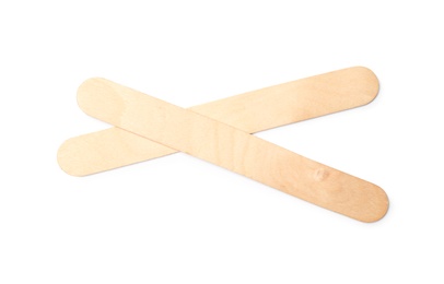 Empty wooden ice cream sticks on white background, top view