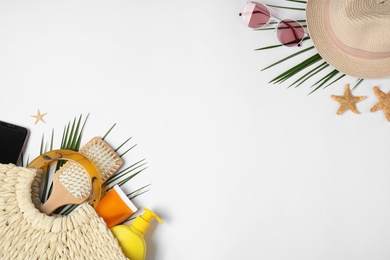 Photo of Flat lay composition with beach accessories and space for text on white background