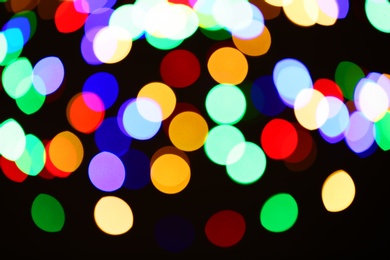 Beautiful colorful lights on dark background. Bokeh effect