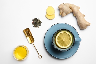 Photo of Composition with lemon tea, honey and ginger on white background, top view