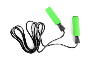 Photo of Black skipping rope with green handles isolated on white, top view