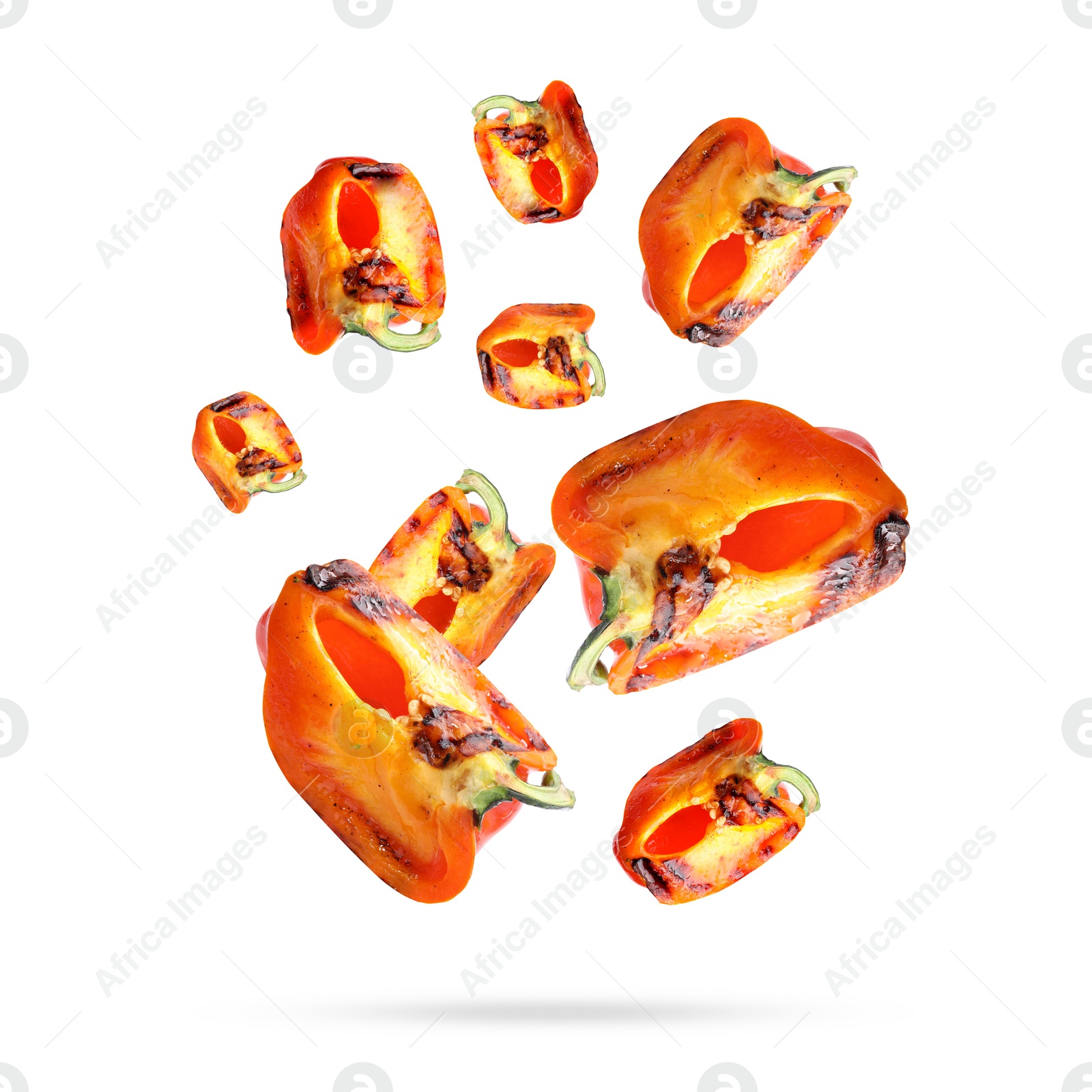 Image of Slices of grilled bell peppers in air on white background