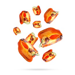 Slices of grilled bell peppers in air on white background