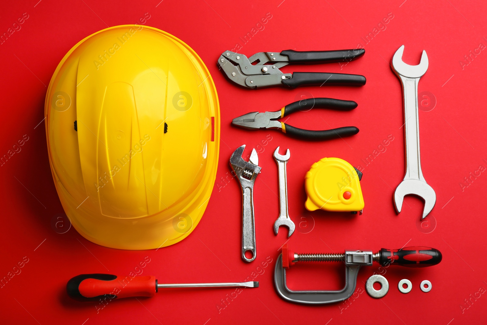 Photo of Flat lay composition with construction tools on color background