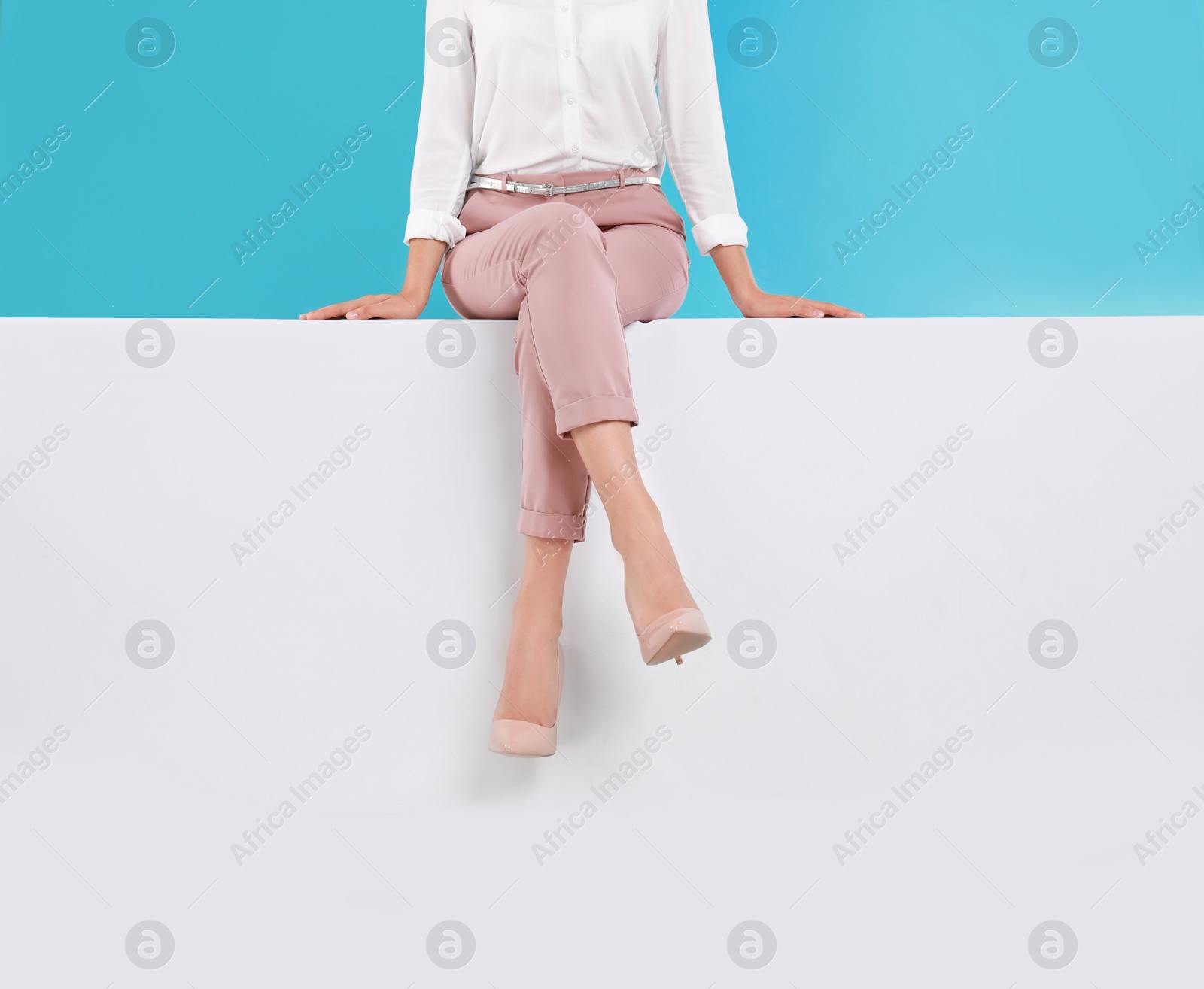 Photo of Woman wearing stylish shoes on color background, closeup