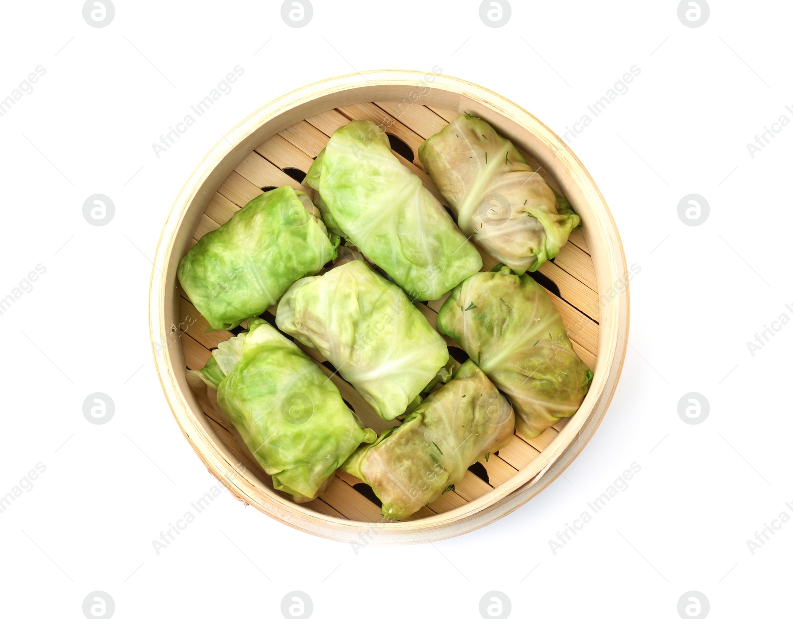 Photo of Bamboo steamer with delicious cabbage rolls on white background, top view