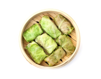 Photo of Bamboo steamer with delicious cabbage rolls on white background, top view