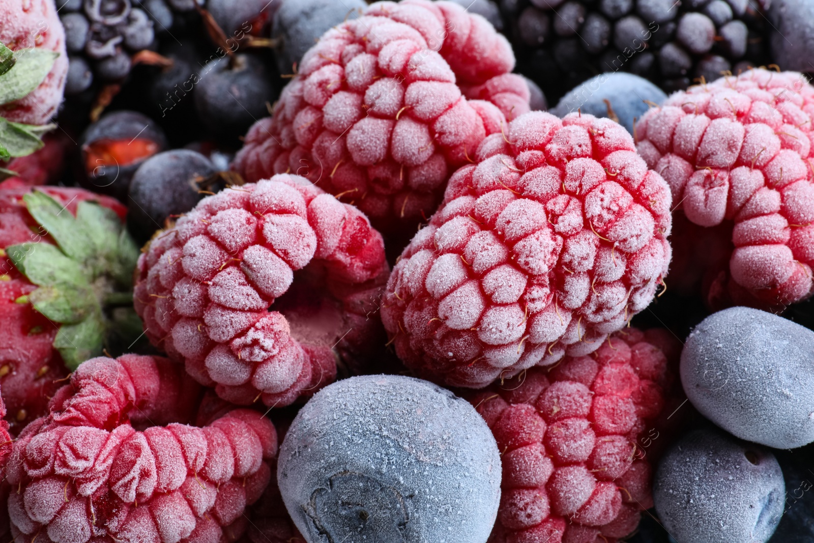 Photo of Mix of different frozen berries as background, top view