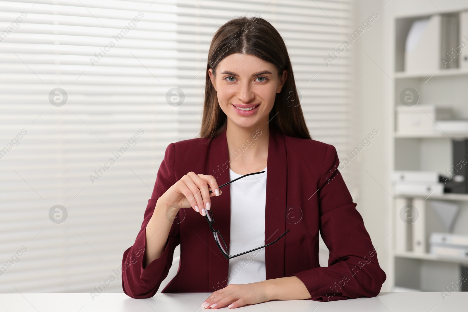 Photo of Happy woman having video call at white desk indoors, view from web camera