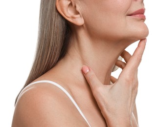 Mature woman touching her neck on white background, closeup