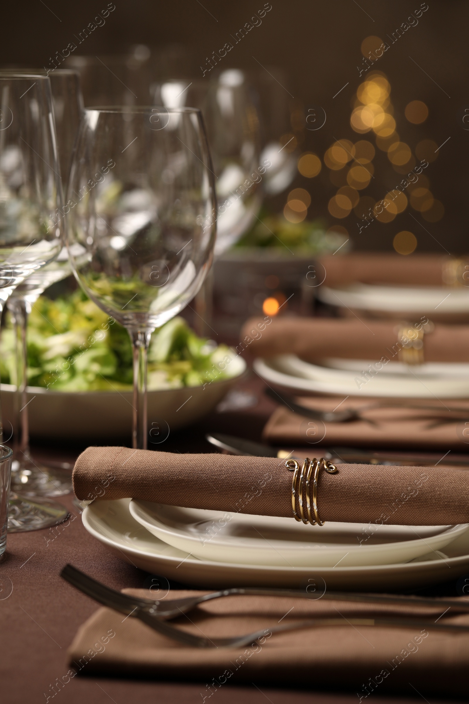 Photo of Stylish elegant table setting for festive dinner in restaurant