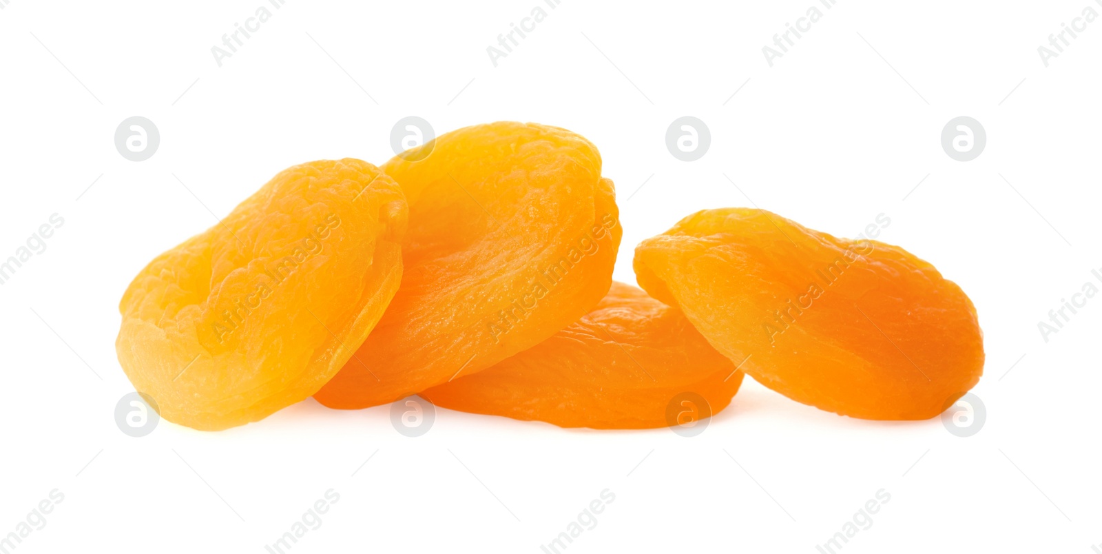 Photo of Pile of tasty apricots on white background. Dried fruits